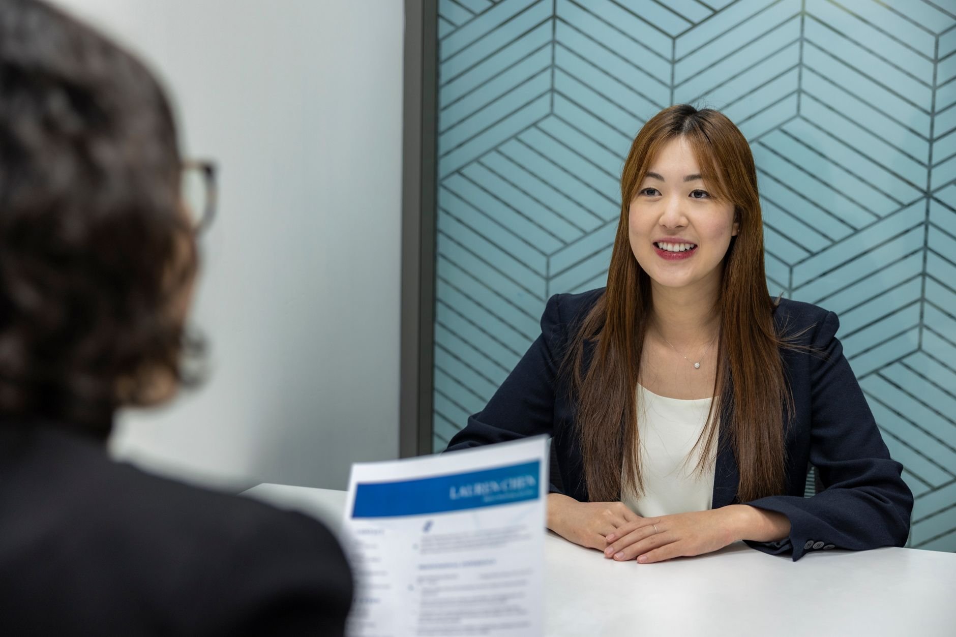 Young woman in a business meeting, showcasing confidence and professionalism